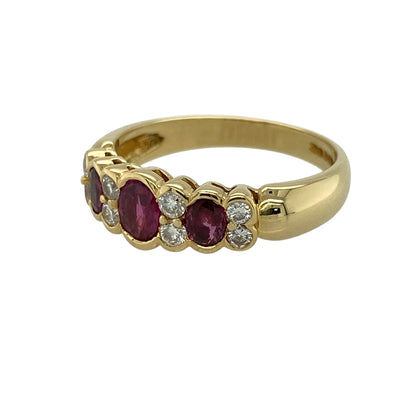Add timeless elegance and rich colour to your jewellery collection with this pre-owned 18ct yellow gold diamond and ruby trilogy ring, featuring classic gemstones and refined sparkle—perfect for special occasions or everyday luxury.

Design: The ring showcases three oval rubies, with the centre stone measuring approximately 5mm by 4mm and the two side stones approximately 4mm by 3mm each, complemented by two diamonds set between the rubies for added brilliance.