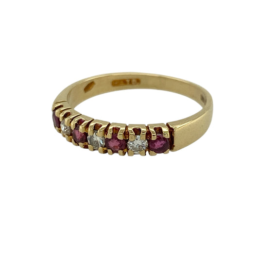 Add a touch of timeless elegance to your jewellery collection with this pre-owned 18ct yellow gold diamond and ruby band ring, featuring classic gemstones and refined sparkle—perfect for everyday wear or special occasions.

Design: The ring features a sleek band design set with alternating rubies and diamonds, creating a subtle yet eye-catching combination of rich red tones and brilliant sparkle.