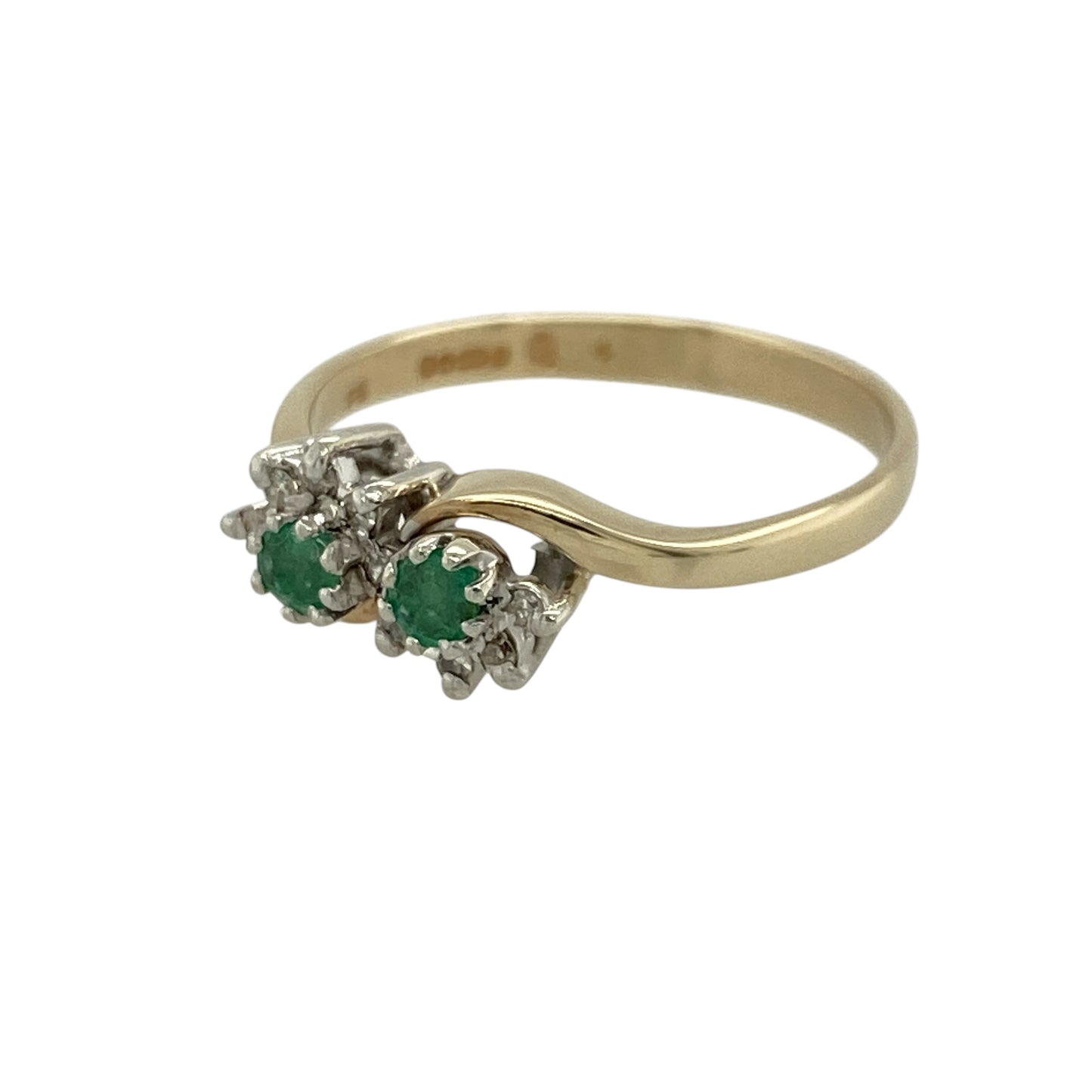 Add vibrant colour and elegant sparkle to your jewellery collection with this pre-owned 9ct yellow gold diamond and emerald double cluster ring, featuring a classic design with a unique twist—perfect for special occasions or refined everyday wear.

Design: The ring features two round emeralds, each approximately 3mm, with each stone surrounded by a cluster of small diamonds, creating a balanced and eye-catching double cluster effect.
