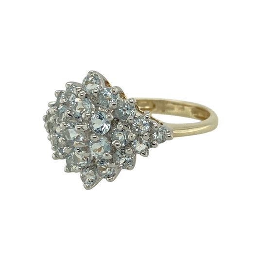 Add eye-catching sparkle to your jewellery collection with this pre-owned 9ct yellow gold cubic zirconia cluster ring, featuring a bold and glamorous design—perfect for special occasions or statement everyday wear.

Design: The ring features a cluster of round cubic zirconia stones, creating a dazzling focal point with plenty of brilliance and light reflection.
Material: Made from 9ct yellow gold, the polished finish enhances the warmth of the metal while complementing the sparkle of the stones.
