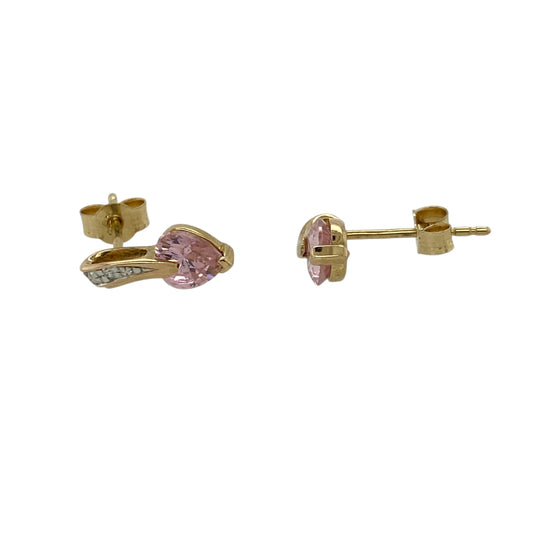 Add a touch of playful colour to your jewellery collection with these pre-owned 9ct yellow gold pink cubic zirconia heart stud earrings, featuring a sweet and timeless design—perfect for everyday wear or gifting.

Design: The earrings feature heart-shaped pink cubic zirconia stones measuring approximately 5mm each, offering a vibrant pop of colour with a charming and feminine look.
