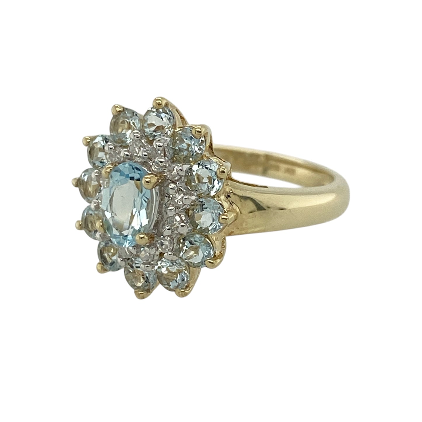 Add soft colour and layered sparkle to your jewellery collection with this pre-owned 9ct yellow gold diamond and aquamarine cluster ring, featuring a bold multi-cluster design—perfect for special occasions or standout everyday wear.

Design: The ring showcases an oval aquamarine measuring approximately 6mm by 4mm at its centre, surrounded by a cluster of diamonds, with an additional outer cluster of aquamarine stones creating a striking double halo effect.