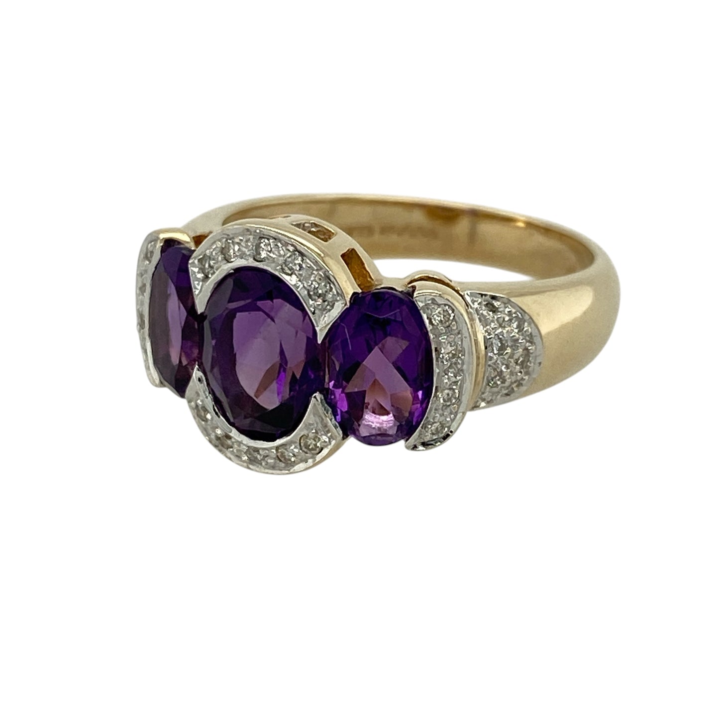 Add bold colour and elegant sparkle to your jewellery collection with this pre-owned 9ct yellow and white gold diamond and amethyst trilogy dress ring, featuring a striking three-stone design—perfect for special occasions or standout wear.

Design: The ring showcases three oval amethysts, with the centre stone measuring approximately 8mm by 6mm and the two side stones approximately 7mm by 5mm each, creating a vibrant and balanced trilogy arrangement.