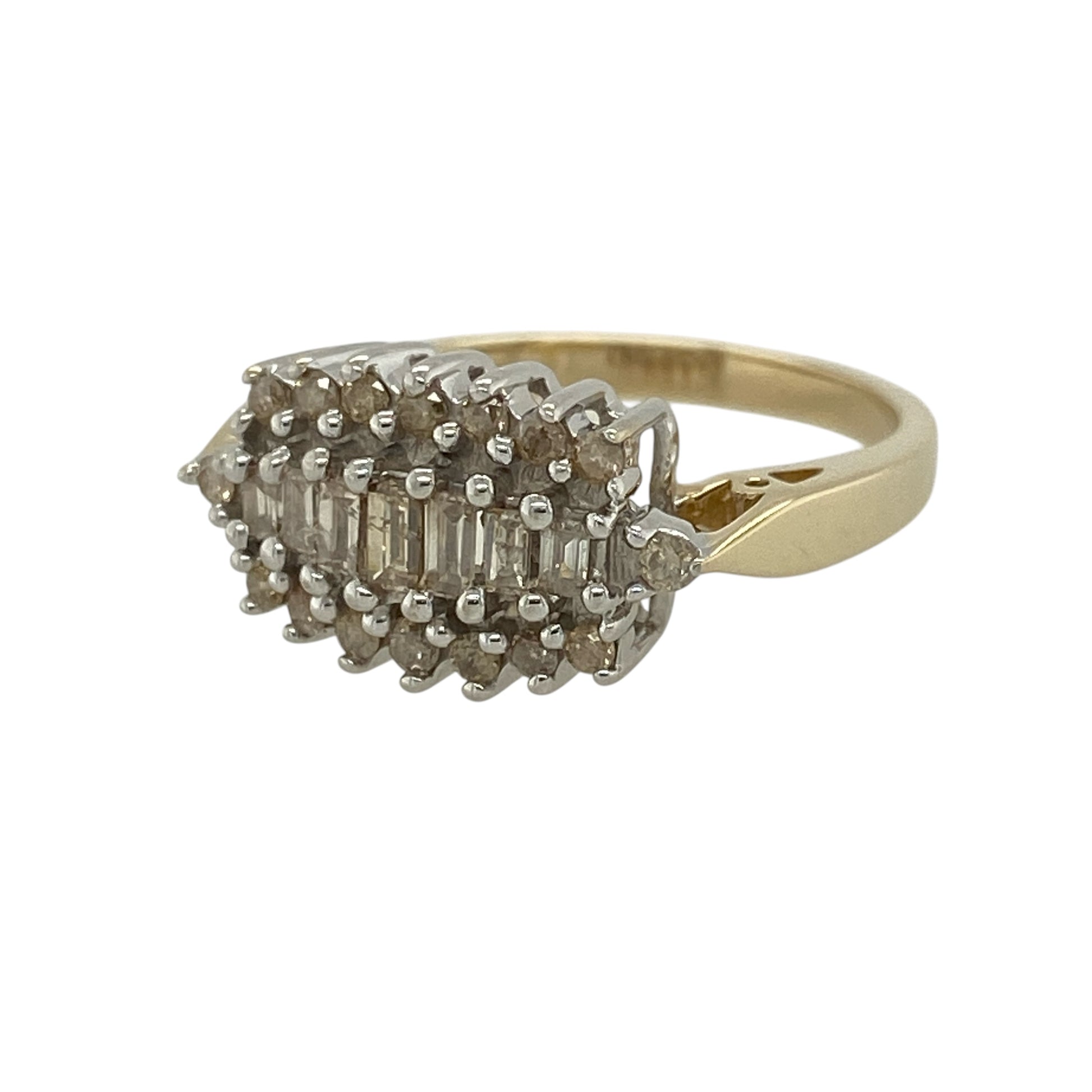 Add bold sparkle and timeless elegance to your jewellery collection with this pre-owned 9ct yellow gold diamond cluster ring, featuring a striking design with impressive brilliance—perfect for special occasions or statement wear.

Design: The ring features a cluster of baguette-cut diamonds at the centre, surrounded by brilliant-cut diamonds, creating a layered and eye-catching display of sparkle.