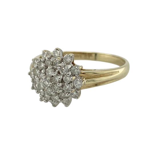 Add bold sparkle to your jewellery collection with this pre-owned 9ct yellow gold diamond cluster ring, featuring a striking design and eye-catching brilliance—perfect for special occasions or statement wear.

Design: The ring showcases a diamond cluster at the centre, creating a dazzling focal point with a classic and timeless appeal.
Material: Made from 9ct yellow gold, the polished finish enhances the warmth of the metal while complementing the sparkle of the diamonds.