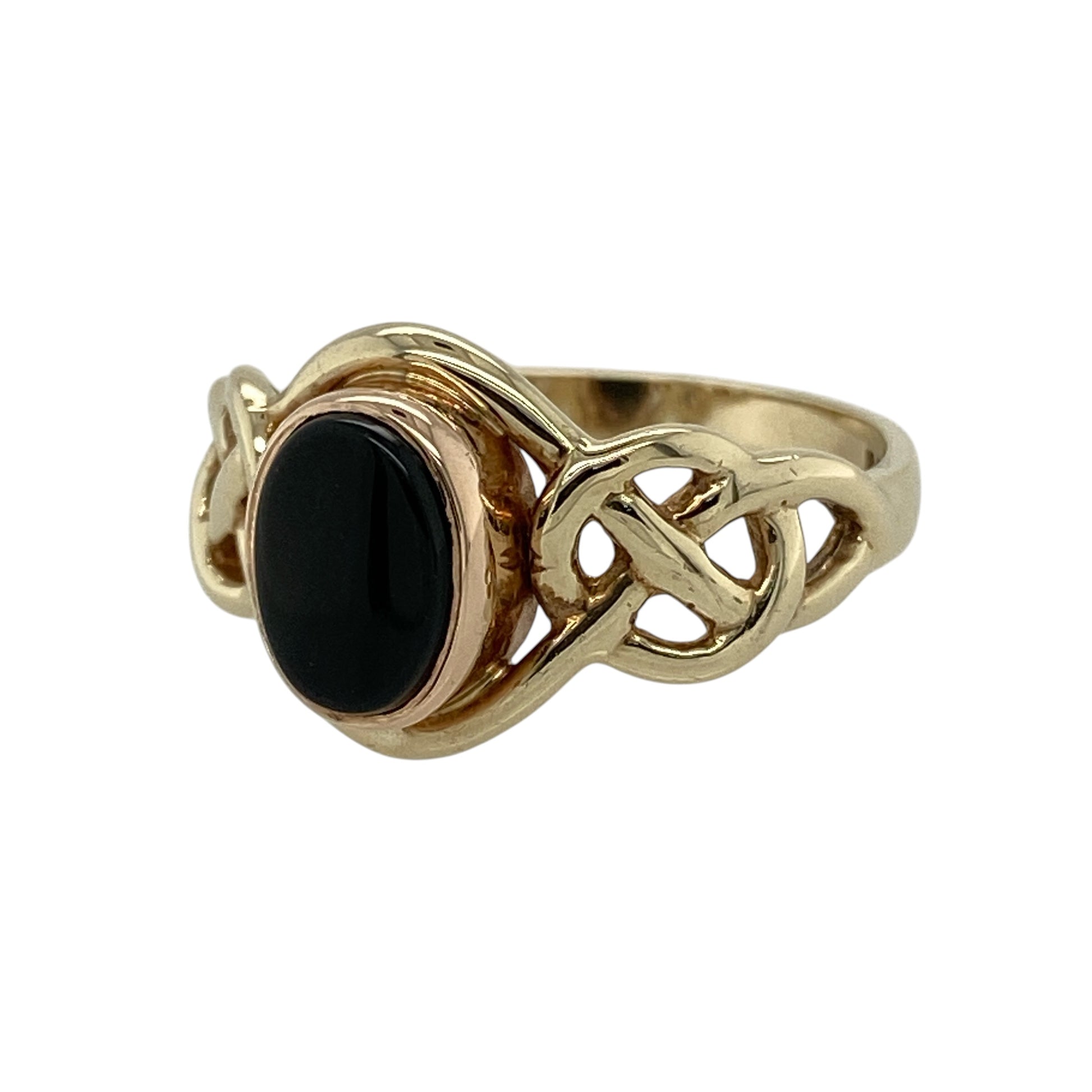 Bring heritage style and bold contrast to your collection with this pre-owned 9ct yellow and rose gold onyx set Clogau Celtic knot ring—a meaningful design rich in symbolism and timeless elegance.

Design: The ring features a 8mm by 6mm deep black onyx stone framed by an intricate Celtic knot design, blending warm yellow and rose gold tones in true Clogau style.
Material: Made from 9-carat yellow and rose gold, the polished finish enhances both the dark sheen of the onyx and the detailed knotwork.
