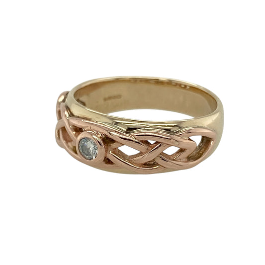 Add meaningful style and elegant detail to your jewellery collection with this pre-owned 9ct yellow and rose gold diamond set Celtic weave band ring, featuring a timeless interwoven design—perfect for everyday wear or special occasions.

Design: The ring showcases a Celtic weave pattern across the front, symbolising eternity and connection, with diamond accents adding a refined touch of sparkle throughout.