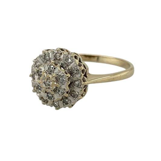 Add elegant sparkle to your jewellery collection with this pre-owned 9ct yellow gold diamond cluster ring, featuring a classic design with eye-catching brilliance—perfect for special occasions or everyday wear.

Design: The ring showcases a diamond cluster at the centre, creating a bright and balanced focal point with timeless appeal.
Material: Made from 9ct yellow gold, the polished finish enhances the warm tone of the metal while complementing the sparkle of the diamonds.