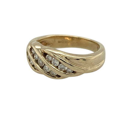 Add elegant sparkle and flowing design to your jewellery collection with this pre-owned 9ct yellow gold diamond set twist band ring, featuring a bold multi-row style—perfect for special occasions or statement everyday wear.

Design: The ring showcases a twist-style band set with three rows of diamonds, creating a layered and eye-catching display of brilliance.
Material: Made from 9ct yellow gold, the polished finish enhances the warm tone of the metal while complementing the sparkle of the diamonds.
