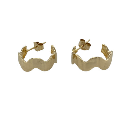 Add flowing elegance to your jewellery collection with these pre-owned 9ct yellow gold wave band half hoop stud earrings, featuring a smooth curved design—perfect for everyday wear or refined styling.

Design: The earrings feature a wave-style band in a half hoop shape, creating a soft, fluid look that adds subtle movement and visual interest.
Material: Made from 9ct yellow gold, the polished finish enhances the warm tone of the metal while highlighting the smooth contours of the design.