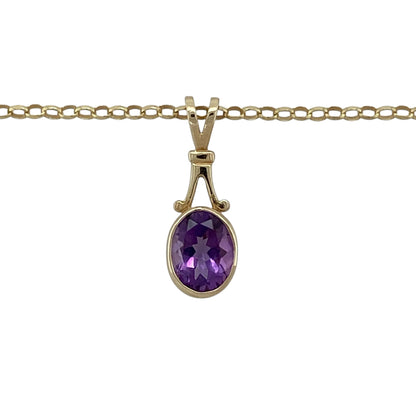 Add rich colour and timeless elegance to your jewellery collection with this pre-owned 9ct yellow gold amethyst pendant necklace, featuring a classic design with a striking centre stone—perfect for everyday wear or special occasions.

Design: The pendant showcases an oval amethyst measuring approximately 8mm by 6mm, offering deep purple tones and a refined, eye-catching look.
