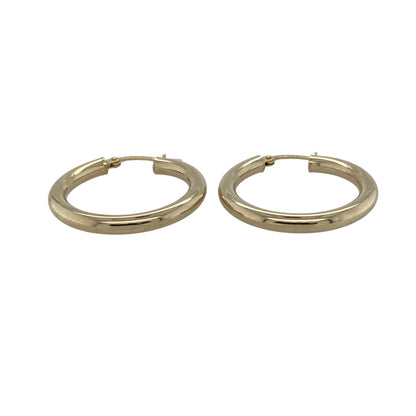 Add timeless simplicity to your jewellery collection with these pre-owned 9ct yellow gold plain hoop creole earrings, featuring a classic design and polished finish—perfect for everyday wear or effortless styling.

Design: The earrings showcase a traditional hoop creole shape with a smooth, plain surface, offering a clean and versatile look that never goes out of style.
Material: Made from 9ct yellow gold, the polished finish enhances the warm tone of the metal, creating a refined and classic appearance.