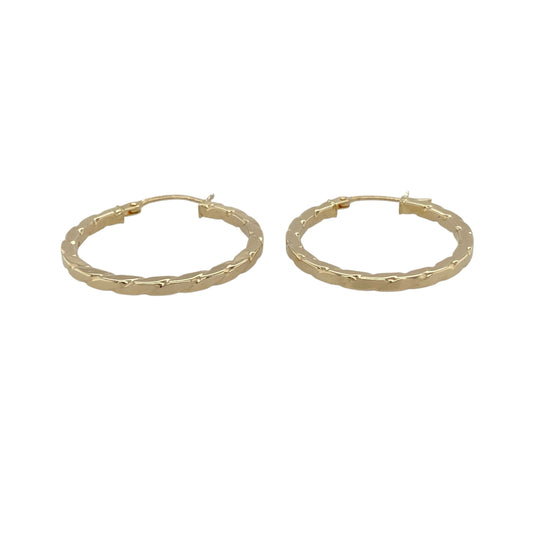 Add a modern twist to a classic style with these pre-owned 9ct yellow gold squared twisted hoop creole earrings, featuring a distinctive shape and elegant texture—perfect for everyday wear or stylish occasions.

Design: The earrings feature a squared hoop shape with a twisted finish, measuring approximately 23mm in diameter, creating a unique combination of structure and movement.
