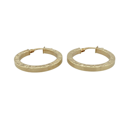 Add a touch of timeless style to your jewellery collection with these pre-owned 9ct yellow gold Roman numeral patterned hoop creole earrings, featuring a classic design with decorative detail—perfect for everyday wear.

Design: The earrings feature a traditional hoop creole shape with a Roman numeral patterned finish, adding a distinctive and stylish element to a timeless look.