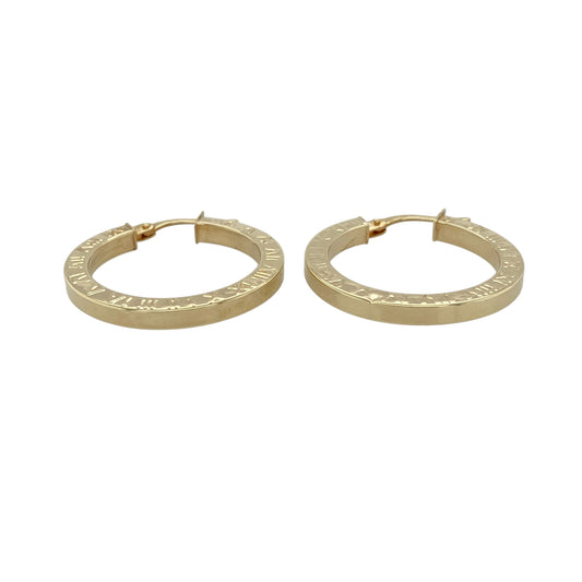 Add a touch of timeless style to your jewellery collection with these pre-owned 9ct yellow gold Roman numeral patterned hoop creole earrings, featuring a classic design with decorative detail—perfect for everyday wear.

Design: The earrings feature a traditional hoop creole shape with a Roman numeral patterned finish, adding a distinctive and stylish element to a timeless look.