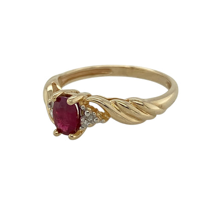 Add rich colour and elegant movement to your jewellery collection with this pre-owned 9ct yellow gold diamond and ruby ring, featuring a graceful design and refined sparkle—perfect for everyday wear or special occasions.

Design: The ring showcases an oval ruby measuring approximately 6mm by 4mm at its centre, complemented by diamond accents and twist-style shoulders that add a flowing, eye-catching detail.