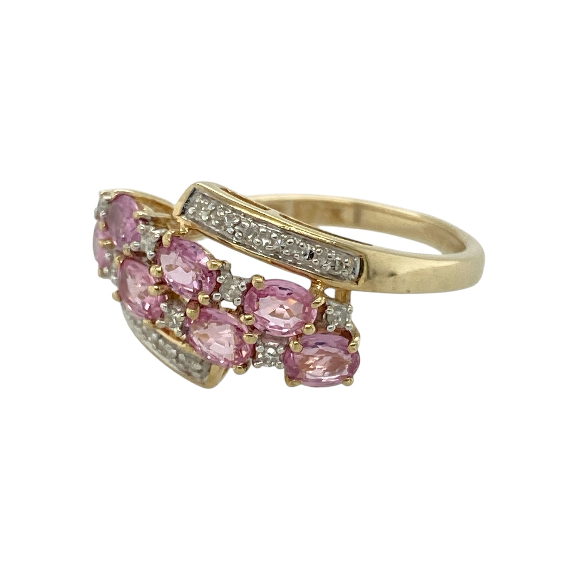 Add vibrant colour and elegant sparkle to your jewellery collection with this pre-owned 9ct yellow gold diamond and pink sapphire cluster ring, featuring a bold and eye-catching design—perfect for special occasions or standout everyday wear.

Design: The ring showcases a cluster of oval pink sapphire stones, complemented by diamonds set in between and along the top and bottom, creating a layered and radiant display of colour and brilliance.