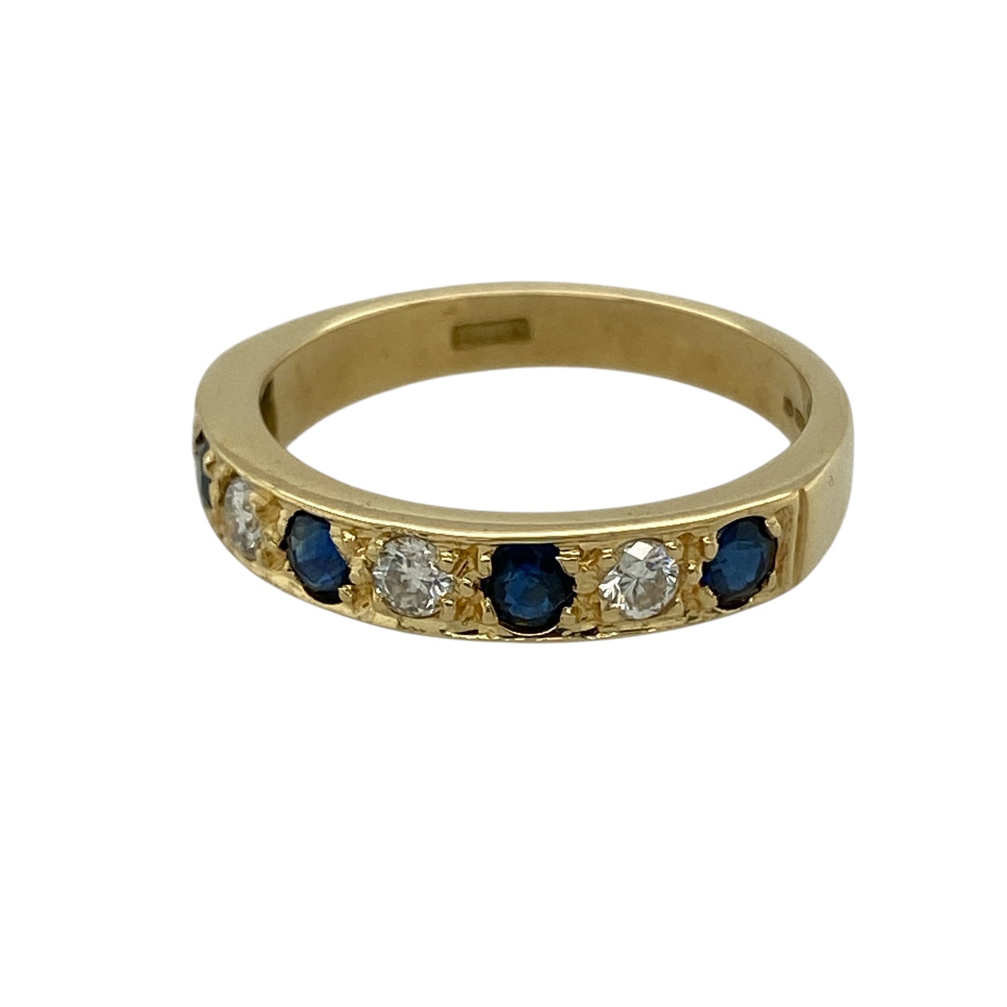Add refined sparkle and timeless colour to your jewellery collection with this pre-owned 18ct yellow gold diamond and sapphire band ring, featuring a classic and elegant design—perfect for everyday wear or special occasions.

Design: The ring features a sleek band set with sapphires and diamonds, creating a beautiful contrast of deep blue tones and subtle brilliance across the front.