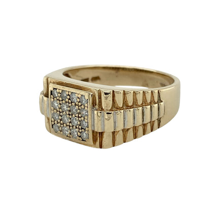 Add bold character and unique design to your jewellery collection with this pre-owned 9ct yellow and white gold diamond set signet ring, featuring a distinctive watch strap style—perfect for statement wear or everyday styling.

Design: The ring showcases a signet-style face measuring approximately 11mm high, set with diamonds for a refined touch of sparkle.
Material: Made from 9ct yellow and white gold, the contrasting tones enhance the design while adding depth and visual interest.