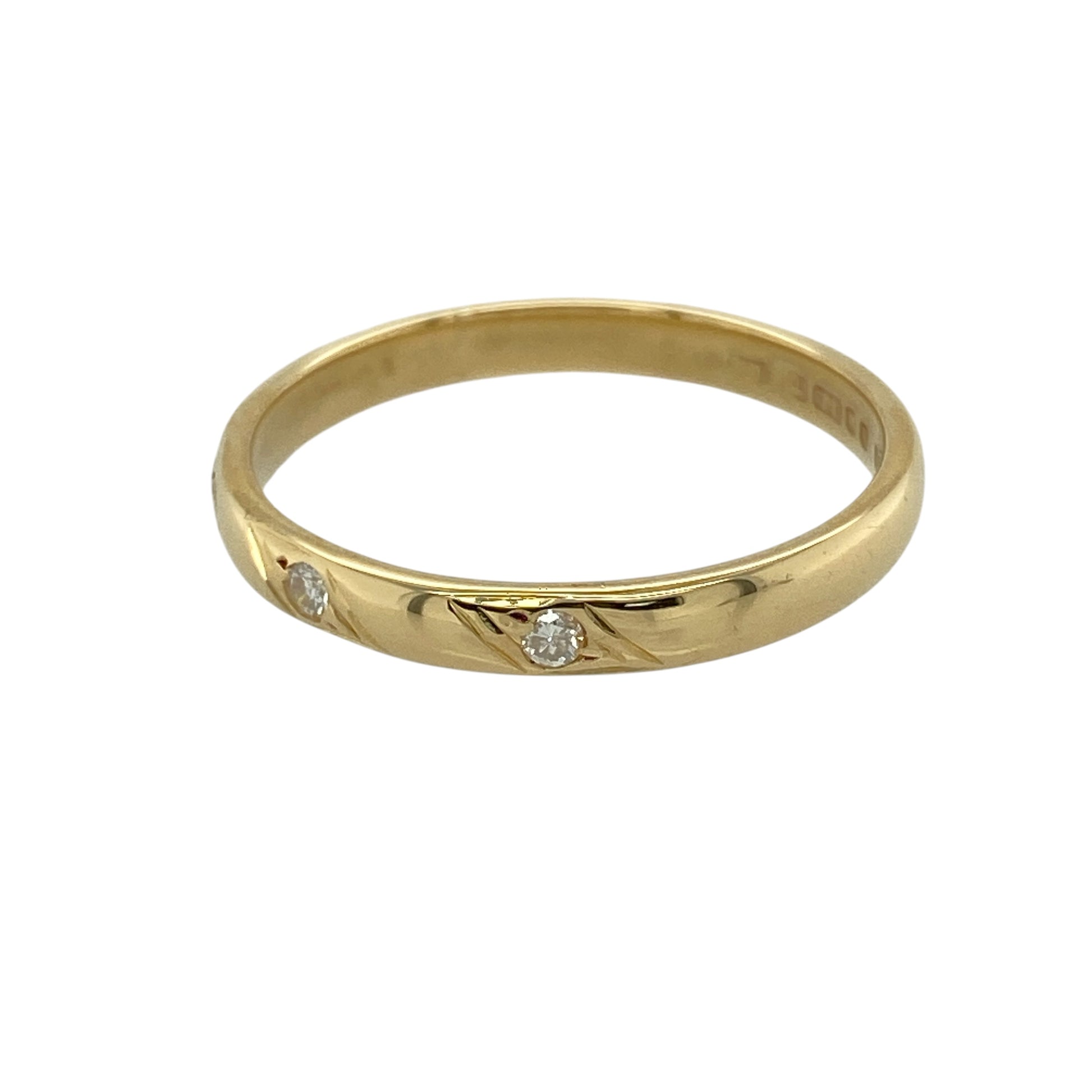 Add refined sparkle and timeless simplicity to your jewellery collection with this pre-owned 18ct yellow gold diamond set band ring, featuring a classic three-stone design—perfect for everyday wear or special occasions.

Design: The ring features three diamonds set across the front, creating a balanced and elegant display of subtle brilliance.
Material: Made from 18ct yellow gold, the polished finish enhances the rich, warm tone of the metal while complementing the sparkle of the diamonds.
