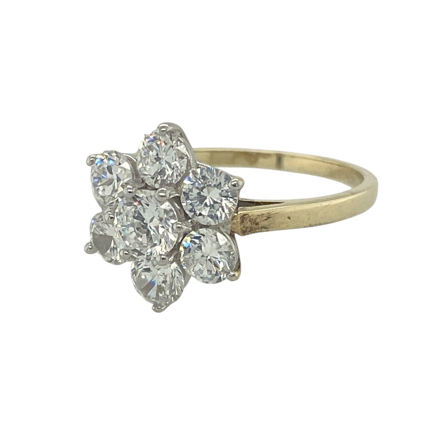 Add a touch of floral elegance and sparkle to your collection with this pre-owned 9ct yellow gold cubic zirconia flower cluster ring—an eye-catching piece inspired by classic cluster designs.

Design: The ring features a 5mm diameter central cubic zirconia, surrounded by smaller stones arranged in a flower cluster formation, creating a bright and elegant display of sparkle.