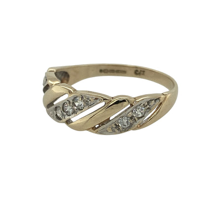 Add modern elegance and subtle sparkle to your collection with this pre-owned 9ct yellow and white gold cubic zirconia open twisted band ring—an eye-catching piece with a contemporary two-tone design.

Design: The ring features an open twisted band style, with the front measuring approximately 6mm wide, creating a flowing and dynamic look enhanced by sparkling cubic zirconia accents.