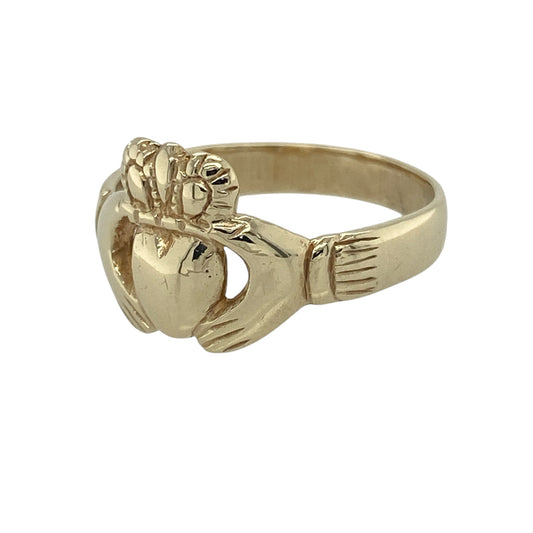 Celebrate tradition and timeless symbolism with this pre-owned 9ct yellow gold Claddagh ring—an iconic design representing love, loyalty, and friendship.

Design: The ring features the classic Claddagh motif, with hands holding a heart topped by a crown, measuring approximately 12mm in height for a bold and recognisable look.
Material: Made from 9-carat yellow gold, the polished finish enhances the warmth of the metal and highlights the detailed design.
