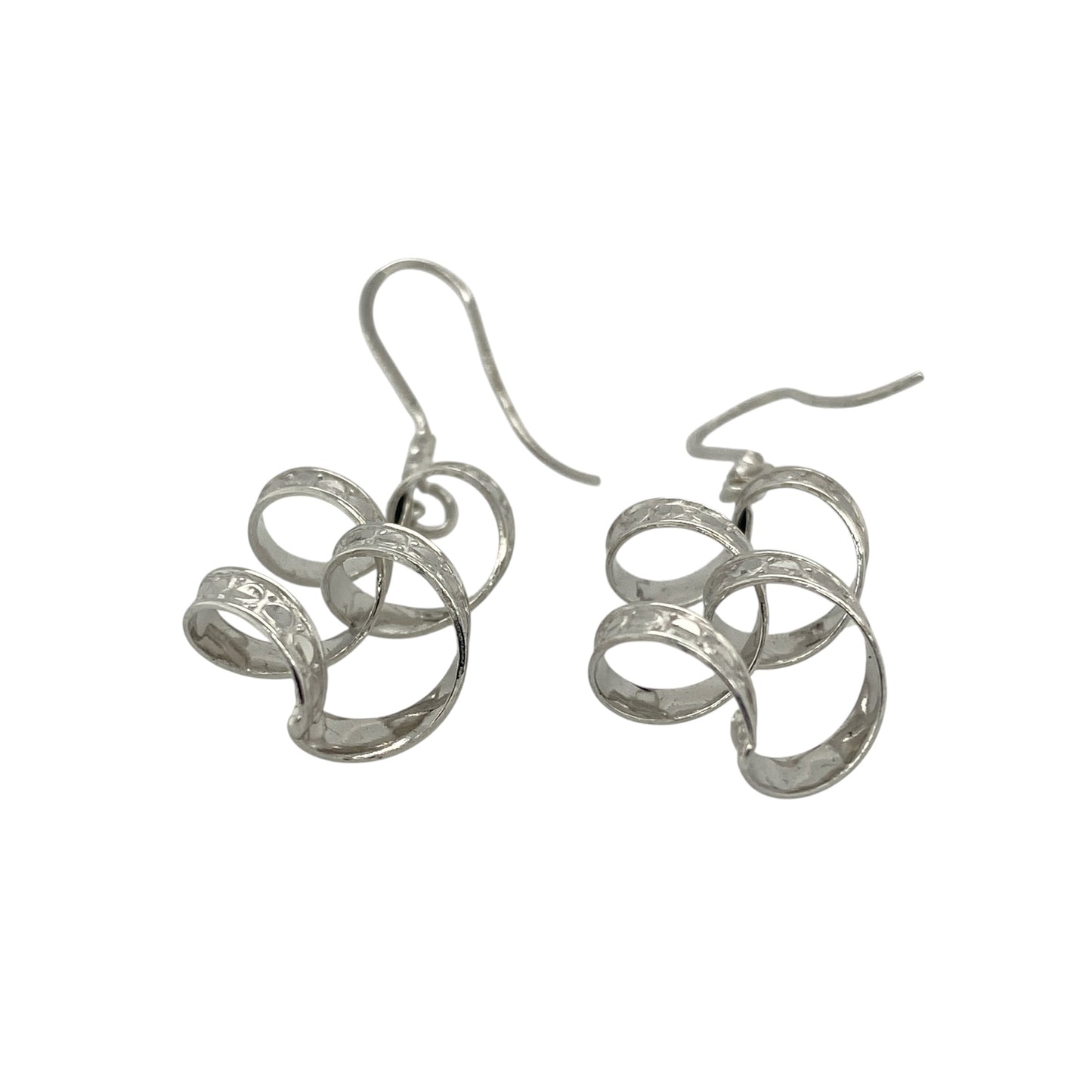 Add elegant movement and modern style to your collection with these pre-owned 9ct white gold patterned twisted drop earrings—an eye-catching pair with a sleek and contemporary finish.

Design: The earrings feature a twisted drop style with subtle patterned detailing, creating texture and fluidity that catches the light beautifully as they move.
Material: Made from 9-carat white gold, the cool-toned polished finish enhances the intricate twist design while offering a refined and versatile look.