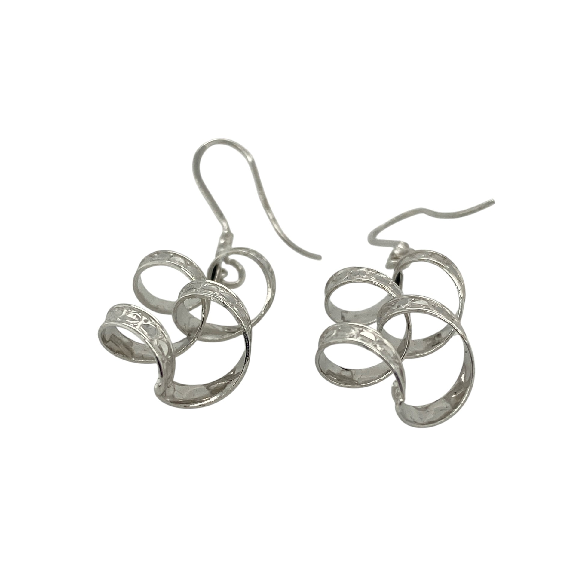 Add elegant movement and modern style to your collection with these pre-owned 9ct white gold patterned twisted drop earrings—an eye-catching pair with a sleek and contemporary finish.

Design: The earrings feature a twisted drop style with subtle patterned detailing, creating texture and fluidity that catches the light beautifully as they move.
Material: Made from 9-carat white gold, the cool-toned polished finish enhances the intricate twist design while offering a refined and versatile look.