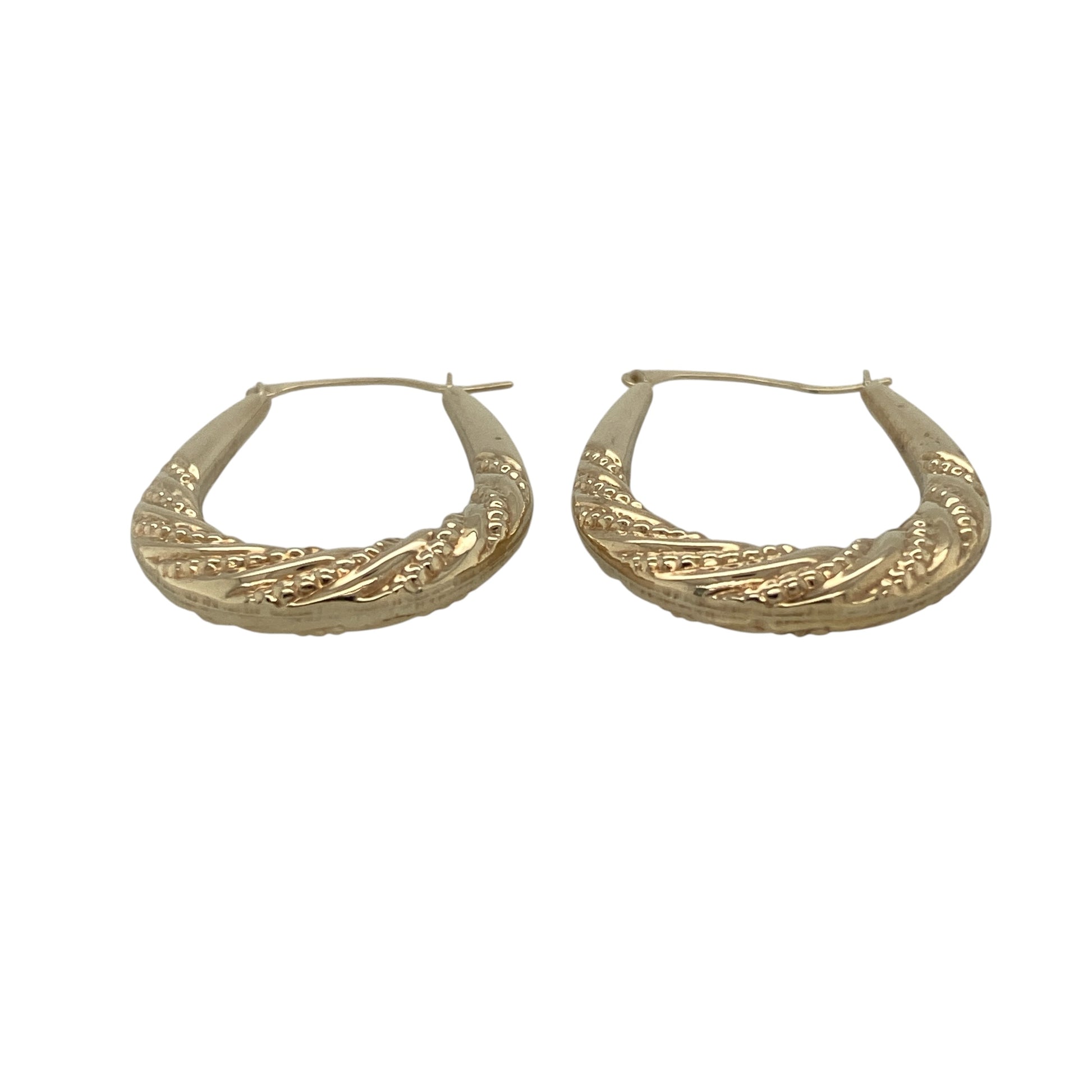 Add texture and timeless elegance to your collection with these pre-owned 9ct yellow gold beaded twist patterned oval creole earrings—an eye-catching pair with intricate detail and classic appeal.

Design: The earrings feature an oval creole shape with a beaded twist pattern, creating a layered and textured look that catches the light beautifully from every angle.