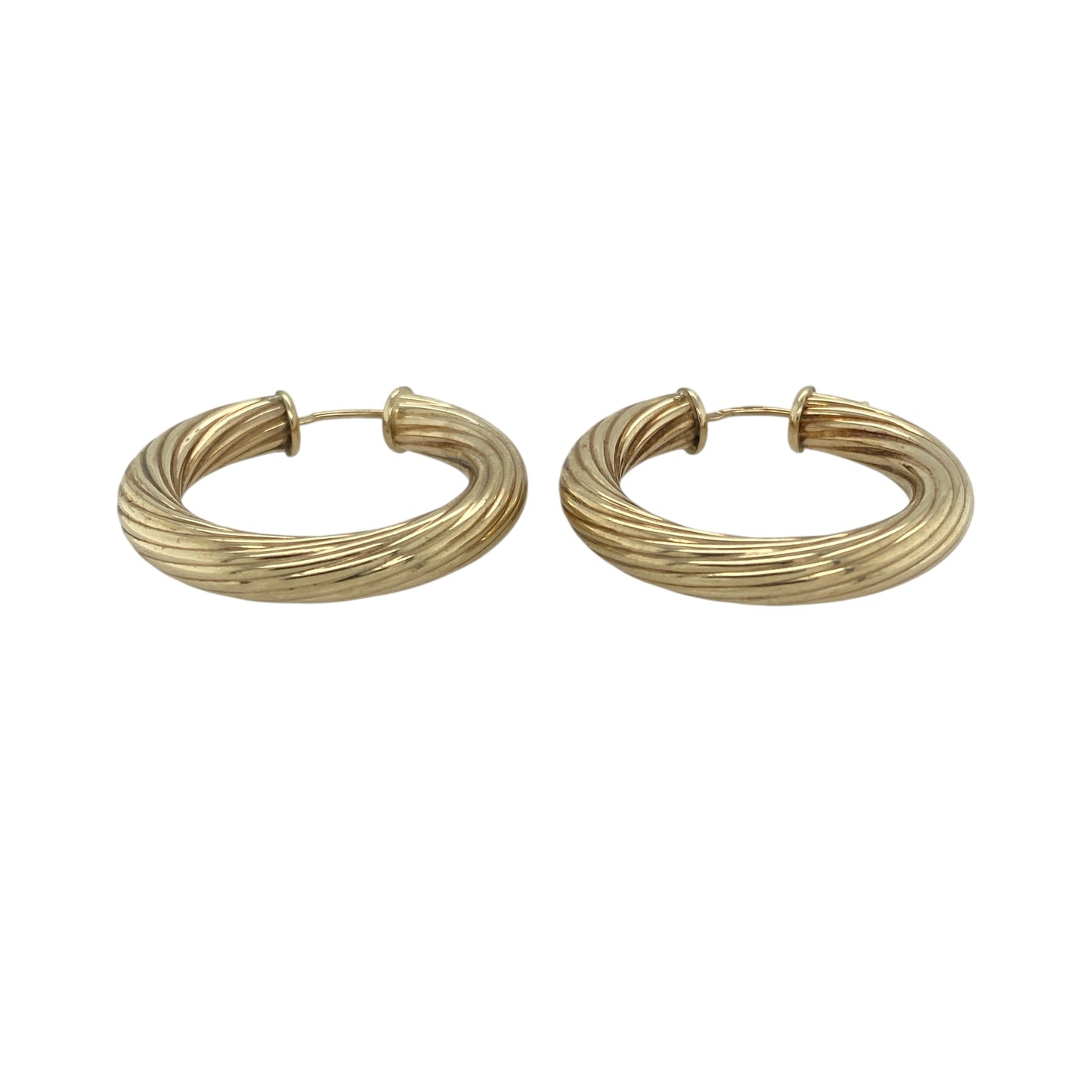 Add bold style and classic texture to your collection with these pre-owned 9ct yellow gold twisted hoop creole earrings—an eye-catching pair with a timeless yet striking design.

Design: The earrings feature a traditional hoop creole shape with a twisted pattern, creating depth and movement that catches the light beautifully for added shine.
Material: Made from 9-carat yellow gold, the polished finish enhances the warmth of the metal while highlighting the twist detail.