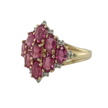 Add bold colour and classic sparkle to your collection with this pre-owned 9ct yellow gold diamond and ruby cluster ring—an eye-catching statement piece with timeless elegance.

Design: The ring features a striking cluster head measuring approximately 18mm in height, set with oval ruby gemstones forming the centre, surrounded by smaller diamonds that create a bright and elegant border. 