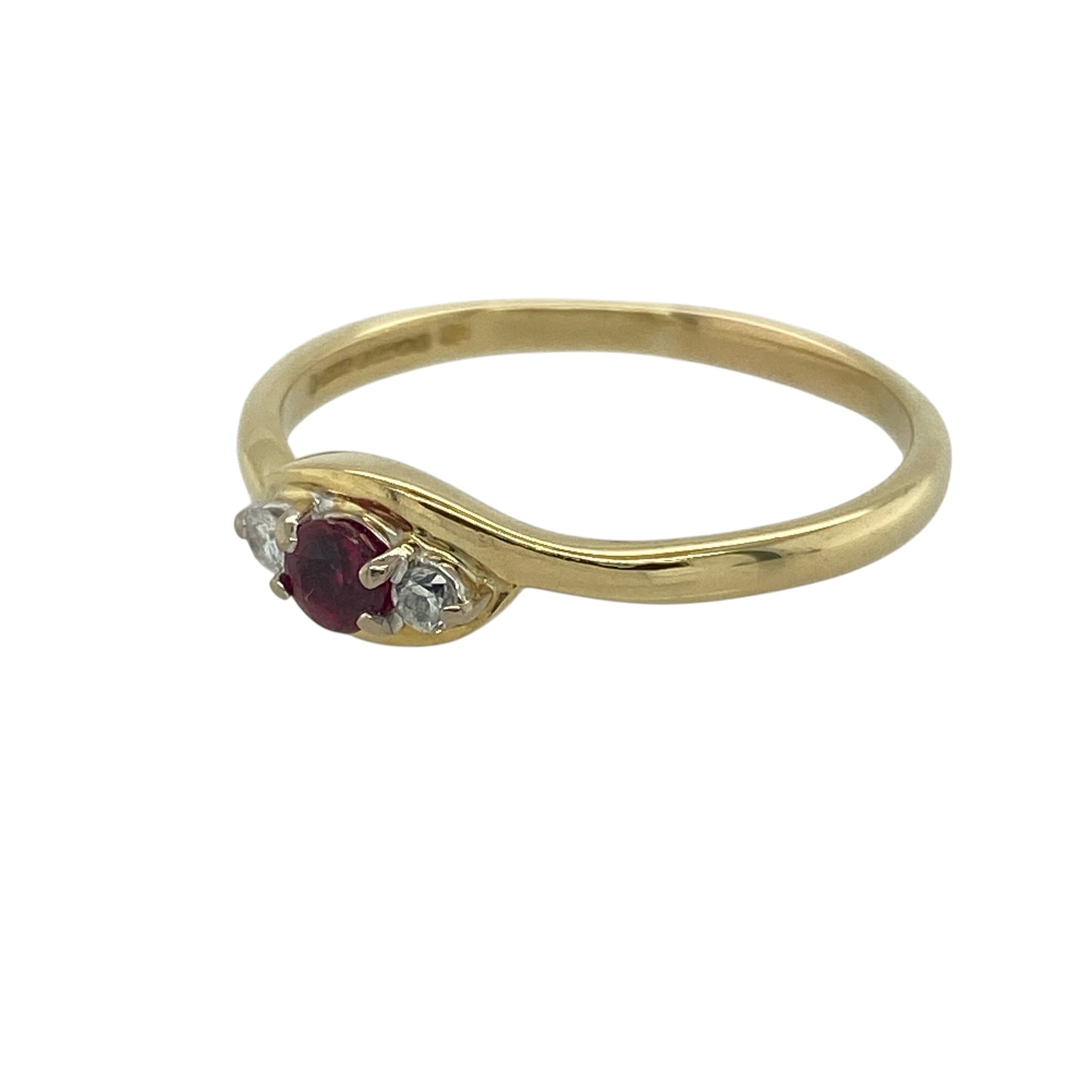 Add timeless elegance and rich colour to your collection with this pre-owned 18ct yellow gold diamond and ruby set trilogy ring—an enduring design that combines luxurious materials with meaningful symbolism.

Design: The ring features a 3mm diameter round ruby at the centre, flanked by a diamond on either side, creating a balanced and refined trilogy arrangement with a striking contrast of colour and sparkle.