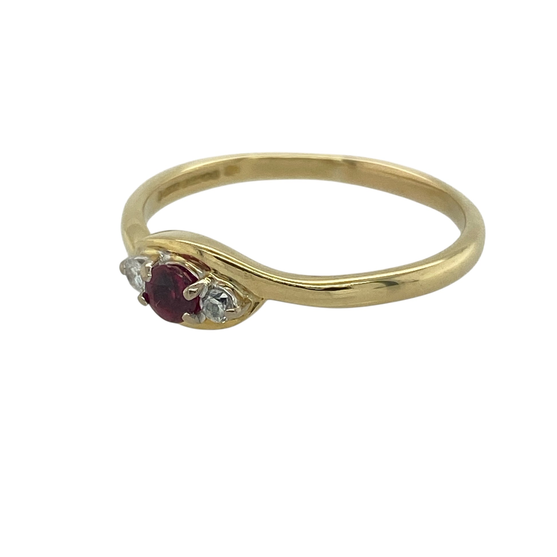 Add timeless elegance and rich colour to your collection with this pre-owned 18ct yellow gold diamond and ruby set trilogy ring—an enduring design that combines luxurious materials with meaningful symbolism.

Design: The ring features a 3mm diameter round ruby at the centre, flanked by a diamond on either side, creating a balanced and refined trilogy arrangement with a striking contrast of colour and sparkle.