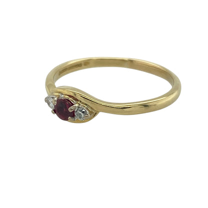 Add timeless elegance and rich colour to your collection with this pre-owned 18ct yellow gold diamond and ruby set trilogy ring—an enduring design that combines luxurious materials with meaningful symbolism.

Design: The ring features a 3mm diameter round ruby at the centre, flanked by a diamond on either side, creating a balanced and refined trilogy arrangement with a striking contrast of colour and sparkle.