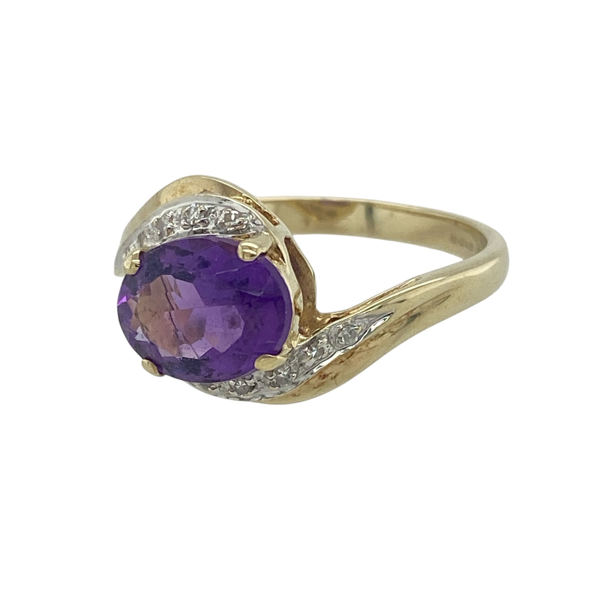 Add elegant colour and graceful design to your collection with this pre-owned 9ct yellow gold diamond and amethyst set twist ring—an eye-catching piece with timeless appeal.

Design: The ring features a 9mm by 7mm oval amethyst centre stone, displaying a rich purple hue, complemented by delicate diamond accents within a flowing twist design that adds movement and interest.