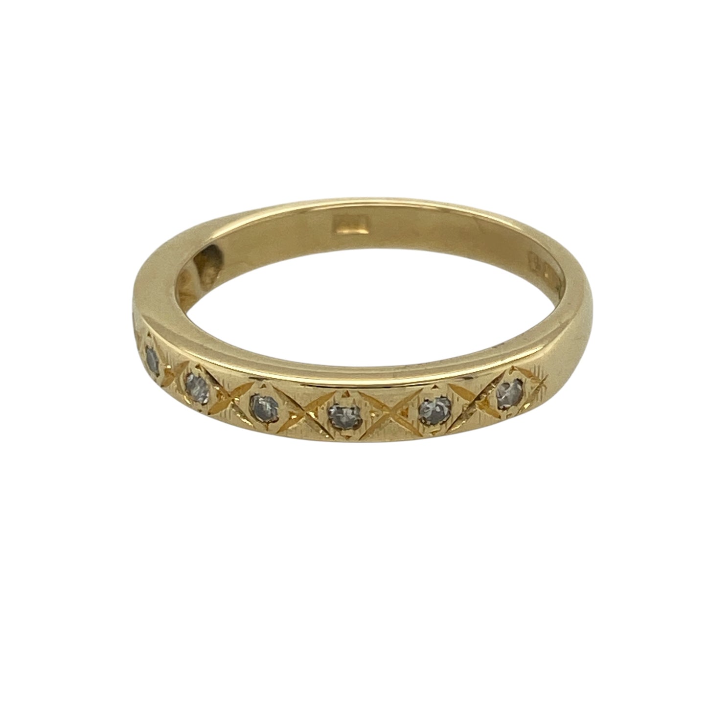 Add refined elegance and subtle sparkle to your collection with this pre-owned 18ct yellow gold diamond set patterned band ring—an understated yet luxurious piece perfect for everyday wear.

Design: The ring features a 3mm wide band at the front, with a patterned finish enhanced by sparkling diamond accents that add a delicate touch of brilliance.
Material: Made from 18-carat yellow gold, the polished and textured finish highlights the richness of the metal while complementing the shimmer of the diamonds.