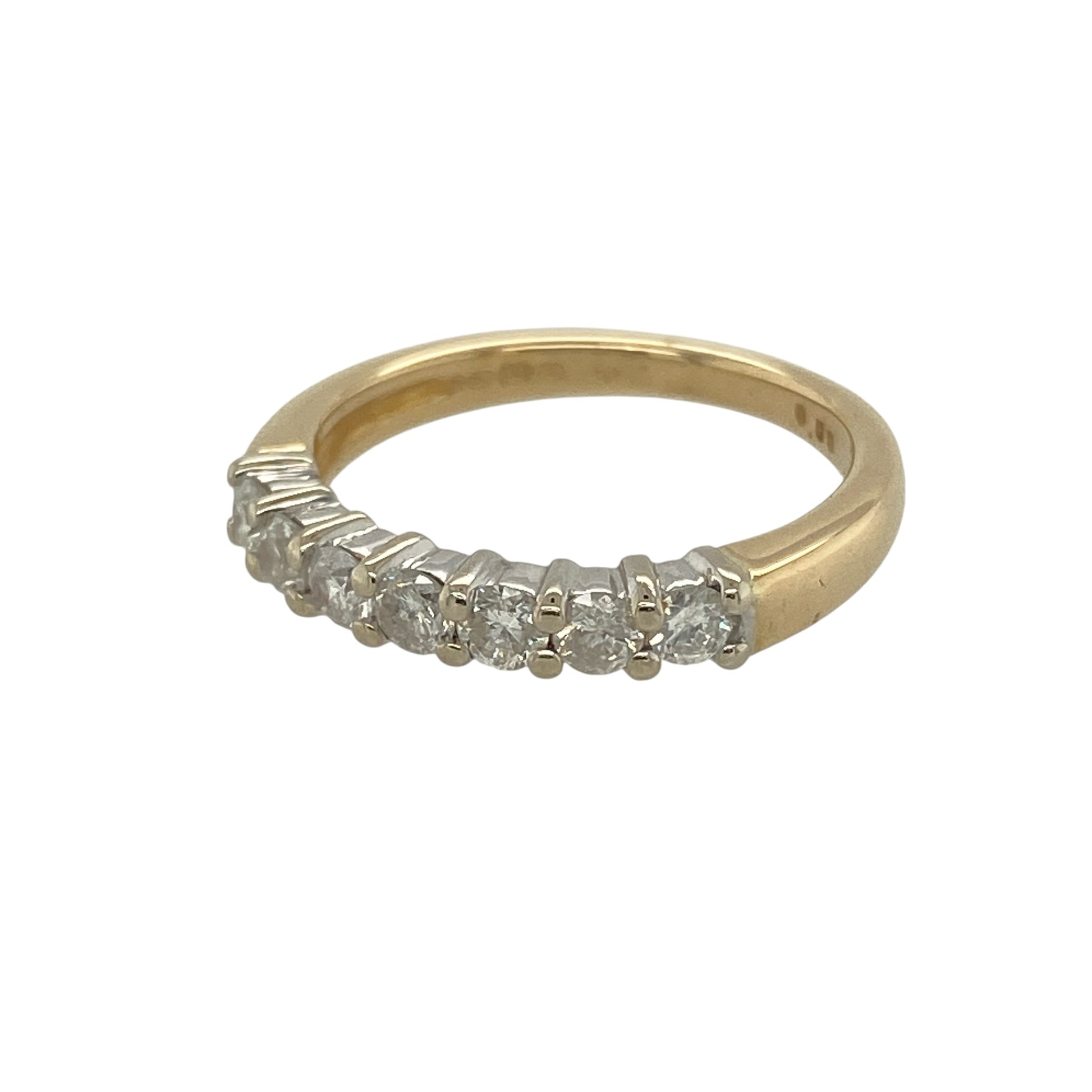 Add timeless elegance and refined sparkle to your collection with this pre-owned 18ct yellow gold diamond set band ring—an eye-catching piece perfect for both everyday wear and special occasions.

Design: The ring features seven brilliant-cut diamonds arranged across the band, offering a balanced and elegant look with a total diamond content of approximately 0.50ct.