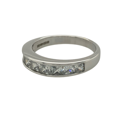 Add modern sparkle and clean lines to your collection with this pre-owned 9ct white gold cubic zirconia set band ring—an elegant piece with a contemporary edge.

Design: The ring features a 4mm wide front set with princess-cut cubic zirconia stones, creating a sleek and structured look with sharp, reflective facets.
Material: Made from 9-carat white gold, the polished finish enhances the cool tone of the metal while complementing the brilliance of the cubic zirconia.
