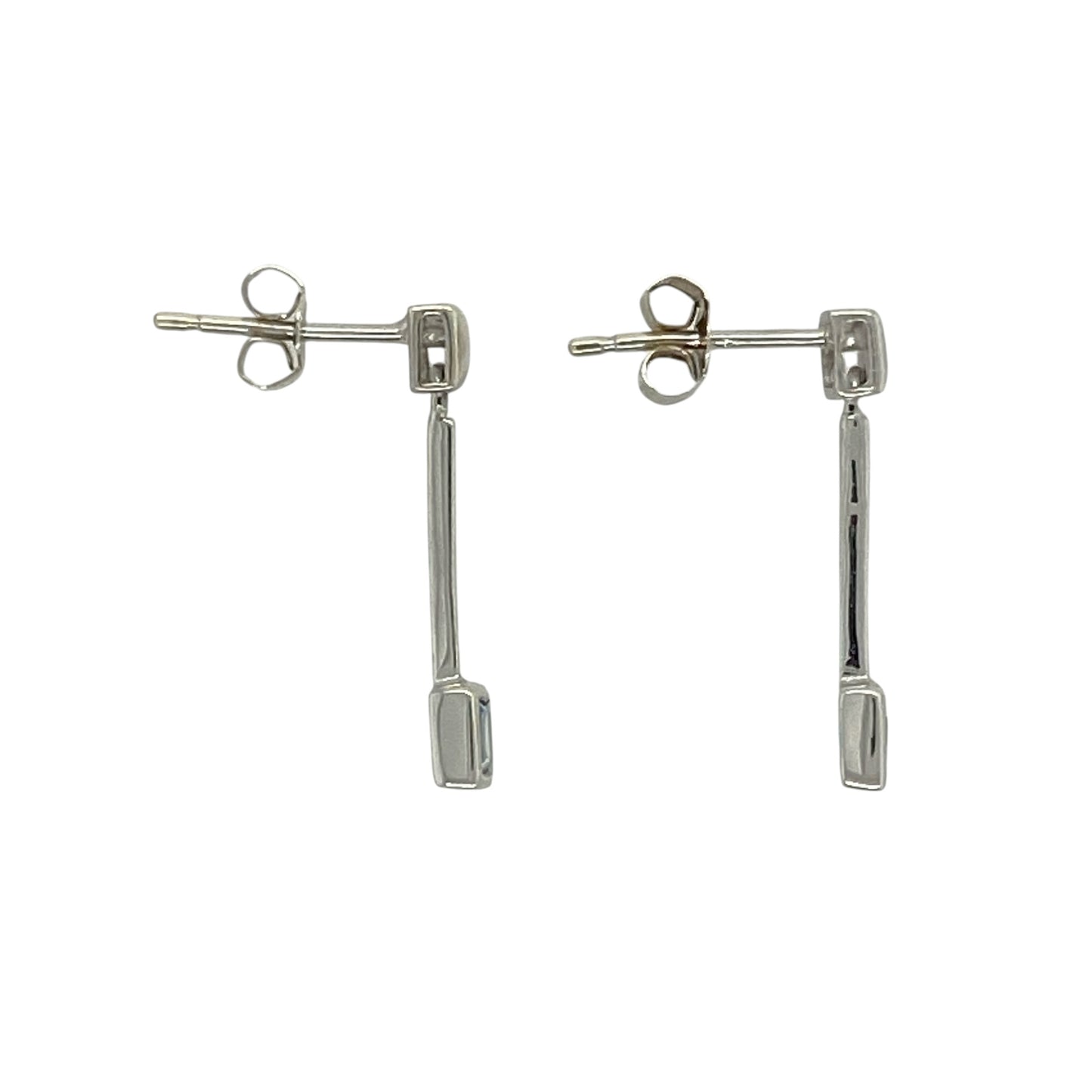 Add a fresh pop of colour and refined elegance to your collection with these pre-owned 9ct white gold blue topaz set drop earrings—an effortlessly stylish pair perfect for any occasion.

Design: The earrings feature a simple drop style, each set with a 3mm by 3mm square blue topaz stone, offering a clean and modern look with a soft blue sparkle.
Material: Made from 9-carat white gold, the polished finish enhances the cool tone of the metal while complementing the brightness of the blue topaz.