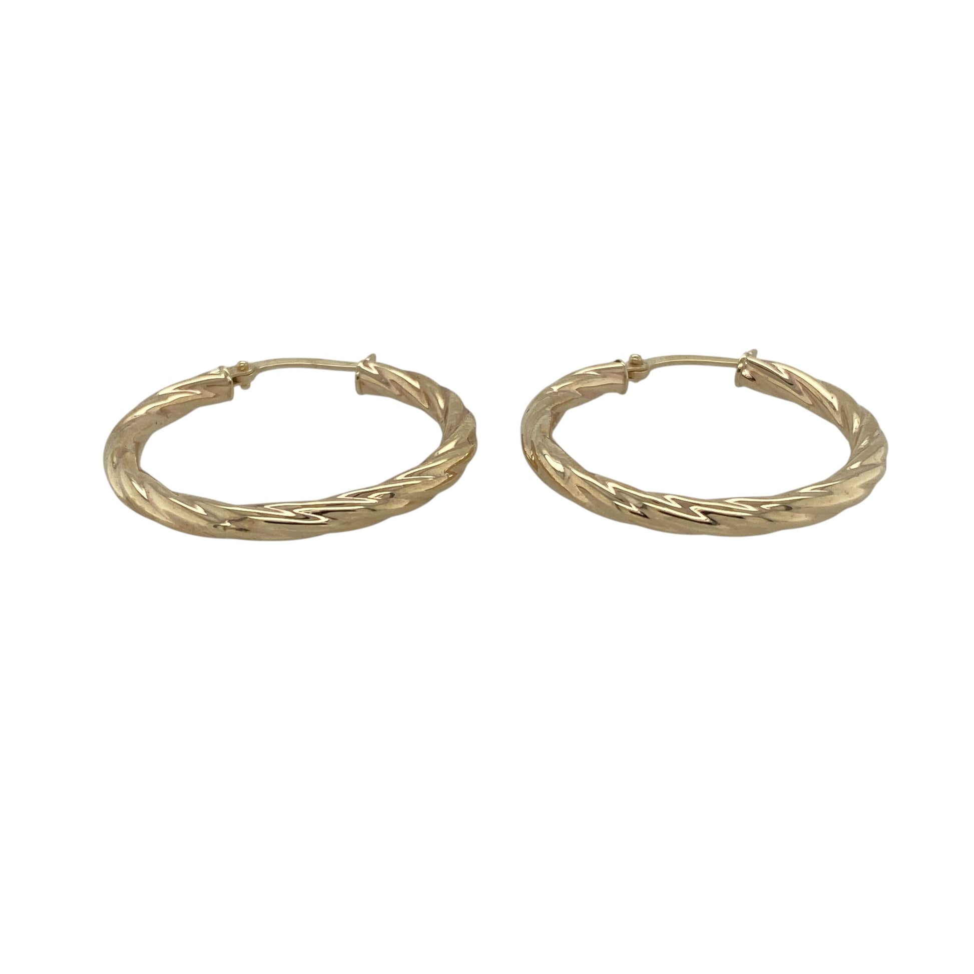 Add classic texture and everyday elegance to your collection with these pre-owned 9ct yellow gold twisted hoop creole earrings—an effortlessly stylish pair with timeless appeal.

Design: The earrings feature a traditional hoop creole shape with a twisted pattern, creating subtle movement and light-catching detail for a refined finish.
Material: Made from 9-carat yellow gold, the polished finish enhances the warmth of the metal while highlighting the twist design.