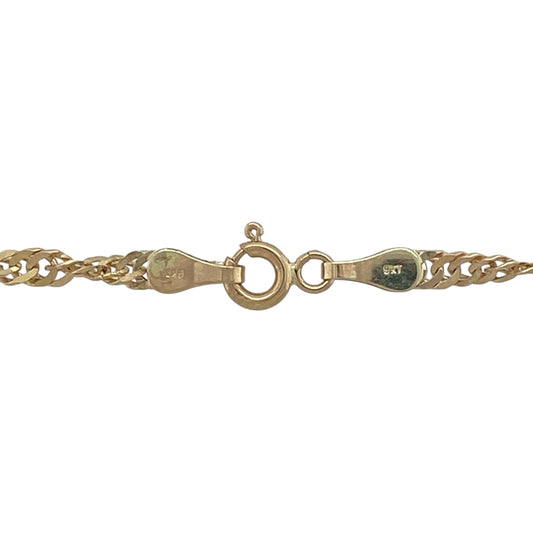 Add elegant movement and standout style to your collection with this pre-owned 9ct yellow gold Singapore chain—an eye-catching piece perfect for everyday wear or layering.

Design: The chain features a 3mm wide Singapore link design, known for its twisted pattern that reflects light beautifully to create a flowing, shimmering effect.
Material: Made from 9-carat yellow gold, the polished finish enhances the warm tone of the metal while highlighting the intricate link style.