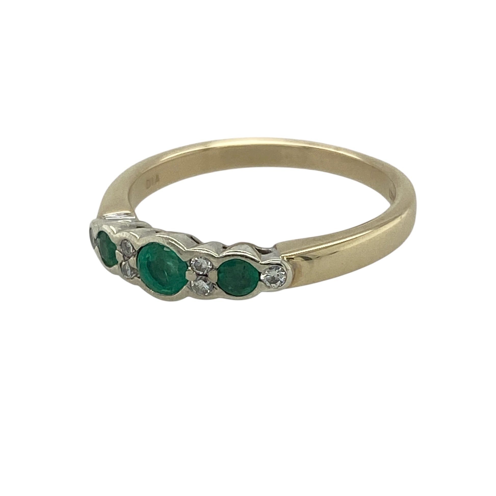 Add elegant colour and classic sparkle to your collection with this pre-owned 9ct yellow gold diamond and emerald set band ring—an effortlessly stylish piece with timeless appeal.

Design: The ring features three emerald gemstones across the band, with the centre emerald measuring approximately 3mm in diameter, complemented by sparkling diamonds positioned between each stone for a balanced and eye-catching look.