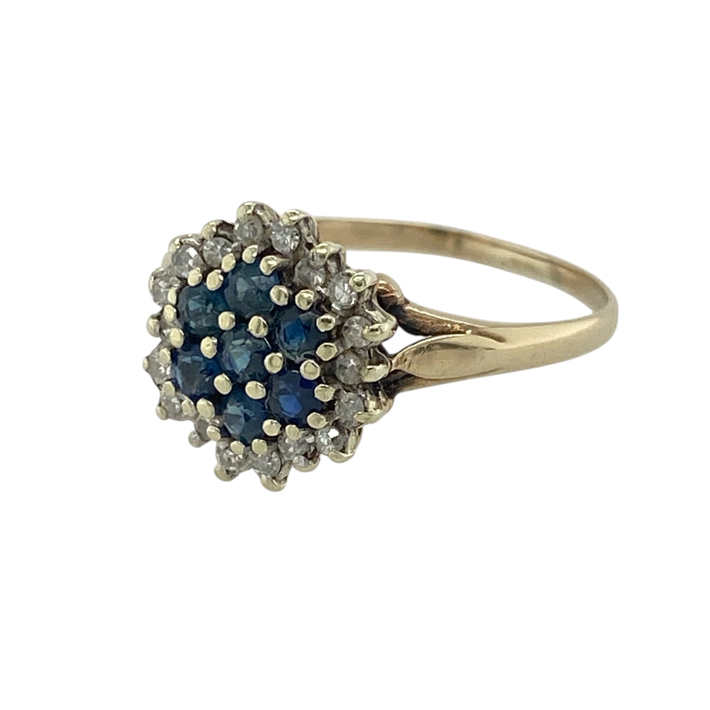 Add bold colour and classic sparkle to your collection with this pre-owned 9ct yellow gold diamond and sapphire set cluster ring—an eye-catching piece with timeless appeal.

Design: The ring features a striking cluster head measuring approximately 11mm in height, formed by multiple sapphire gemstones at the centre, surrounded by sparkling diamonds that create a bright and elegant border.