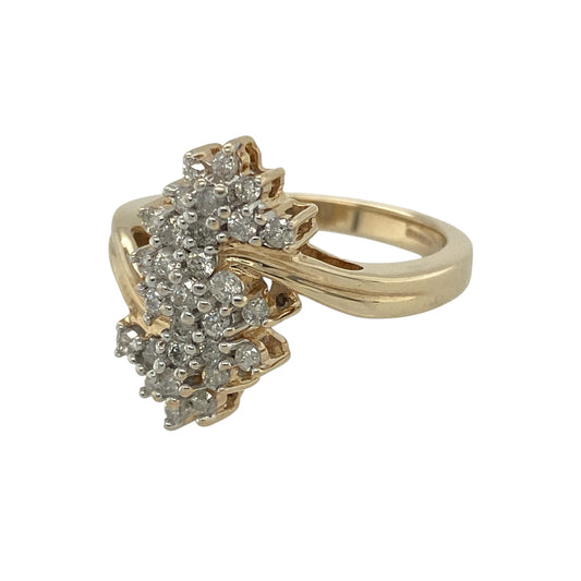 Add bold sparkle and standout style to your collection with this pre-owned 9ct yellow gold diamond set double cluster ring—an eye-catching piece with a strong and elegant presence.

Design: The ring features a striking double cluster front measuring approximately 17mm in height, set with sparkling diamonds that create a bright and impactful display.
Material: Made from 9-carat yellow gold, the polished finish enhances the warmth of the metal while complementing the brilliance of the diamonds.