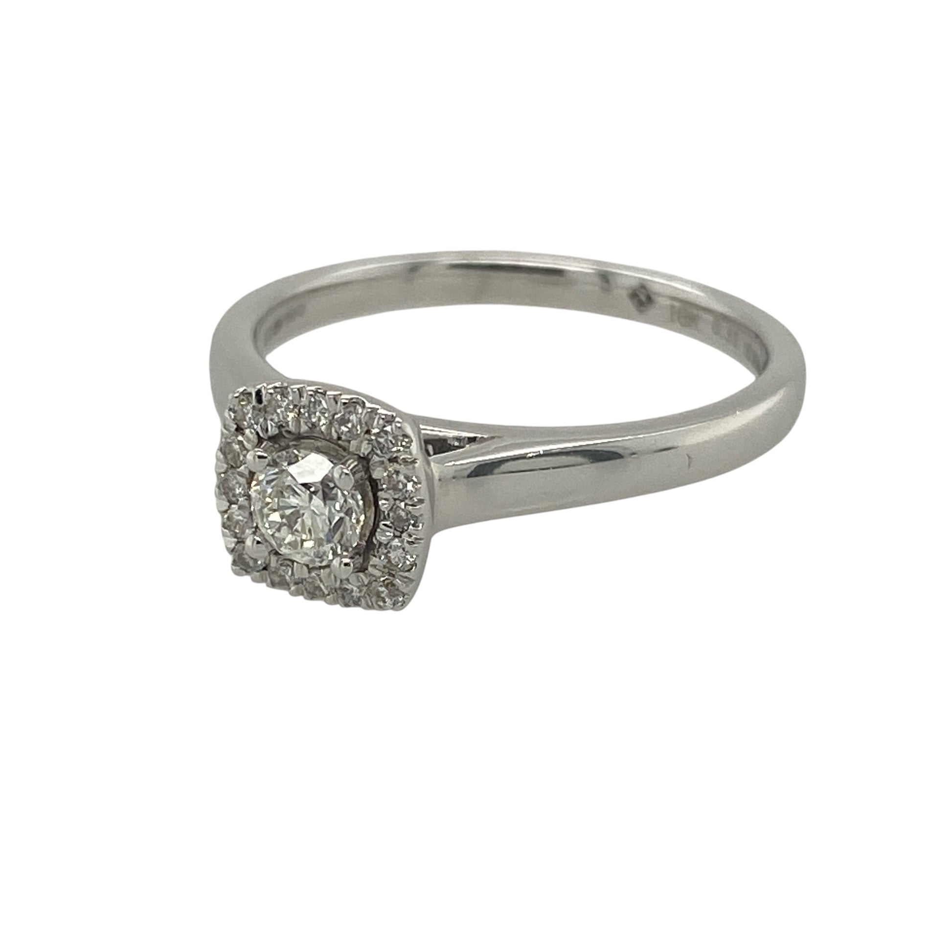 Add timeless sparkle and refined elegance to your collection with this pre-owned 18ct white gold diamond set brilliant cut halo ring—an eye-catching piece with classic appeal.

Design: The ring features a central brilliant-cut diamond surrounded by a halo of smaller diamonds, creating a bright and elegant focal point, with approximately 0.33ct of total diamond content for a beautiful, balanced sparkle.