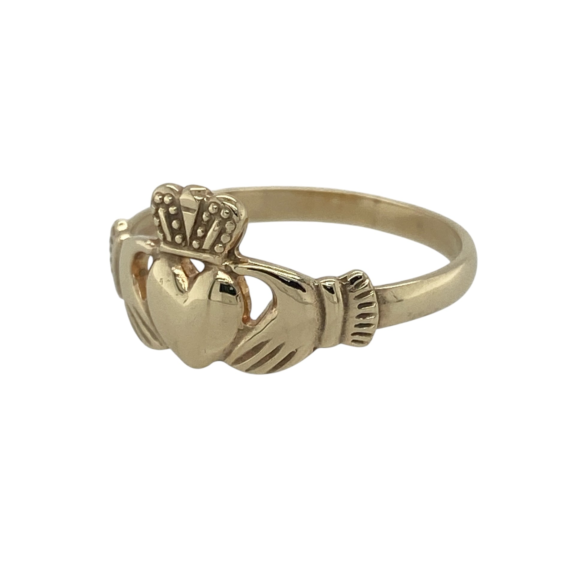 Celebrate tradition and timeless symbolism with this pre-owned 9ct yellow gold Claddagh ring—an elegant and meaningful piece with classic appeal.

Design: The ring features the iconic Claddagh motif, with hands holding a heart topped by a crown, measuring approximately 10mm in height for a balanced and recognisable look.
Material: Made from 9-carat yellow gold, the polished finish enhances the warmth of the metal while highlighting the detailed design.