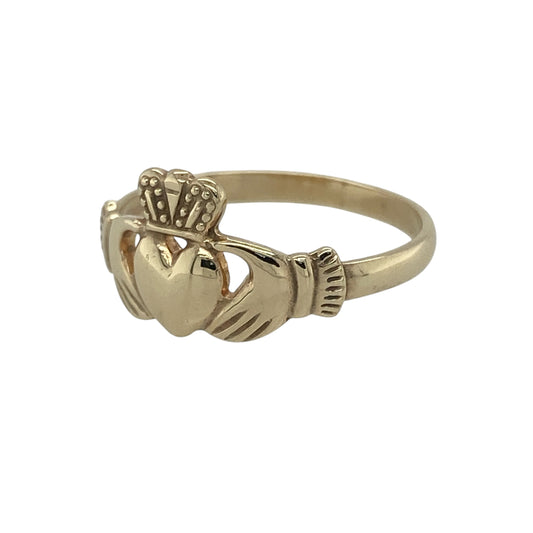 Celebrate tradition and timeless symbolism with this pre-owned 9ct yellow gold Claddagh ring—an elegant and meaningful piece with classic appeal.

Design: The ring features the iconic Claddagh motif, with hands holding a heart topped by a crown, measuring approximately 10mm in height for a balanced and recognisable look.
Material: Made from 9-carat yellow gold, the polished finish enhances the warmth of the metal while highlighting the detailed design.
