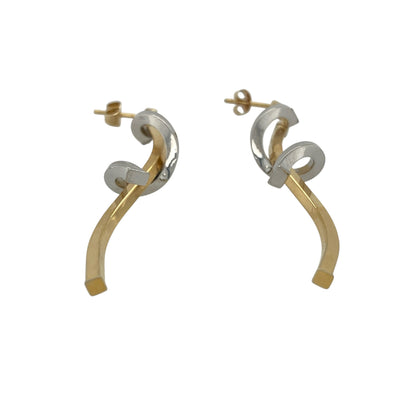 Add elegant movement and contemporary style to your collection with these pre-owned 9ct yellow and white gold spiral drop earrings—an eye-catching pair with a modern twist.

Design: The earrings feature a flowing spiral drop design, creating a sense of movement and fluidity that catches the light beautifully.
Material: Made from 9-carat yellow and white gold, the two-tone finish enhances the spiral shape while adding contrast and visual interest.