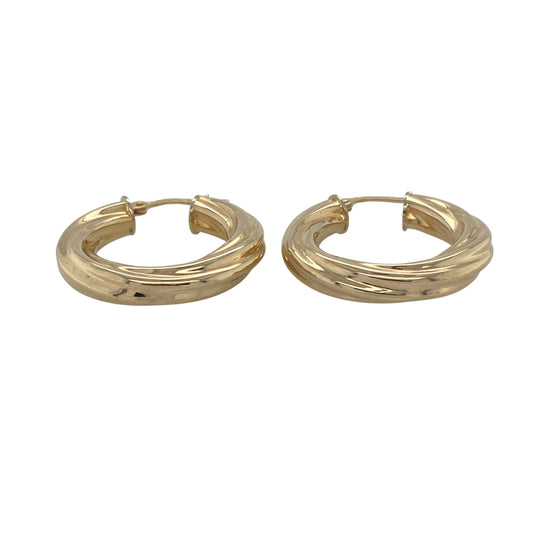 Add classic texture and timeless style to your collection with these pre-owned 9ct yellow gold twisted hoop earrings—an effortlessly elegant pair perfect for everyday wear.

Design: The earrings feature a traditional hoop shape with a twisted pattern, creating depth and light-catching detail for a refined and eye-catching finish.
Material: Made from 9-carat yellow gold, the polished finish enhances the warmth of the metal while highlighting the twist design.